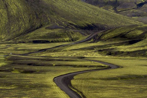 Iceland Road curves through green countryside